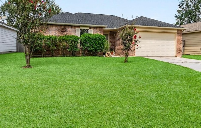 single story home with a front yard and a garage