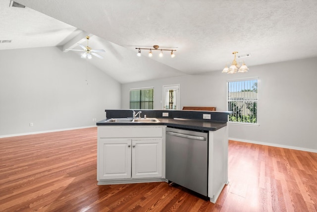 kitchen with dishwasher, white cabinets, sink, vaulted ceiling with beams, and wood-type flooring