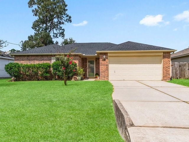 ranch-style home with a front yard and a garage