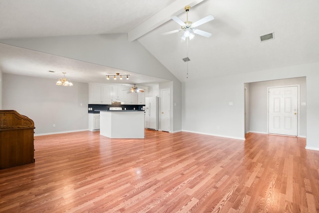 unfurnished living room with ceiling fan with notable chandelier, beam ceiling, high vaulted ceiling, and light hardwood / wood-style flooring