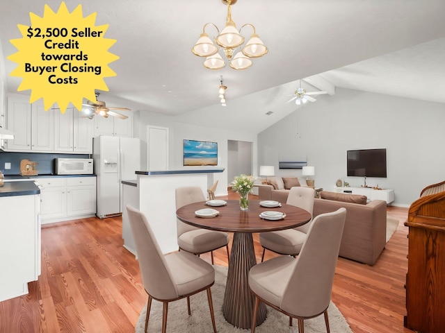 dining room featuring ceiling fan with notable chandelier, vaulted ceiling with beams, and light wood-type flooring