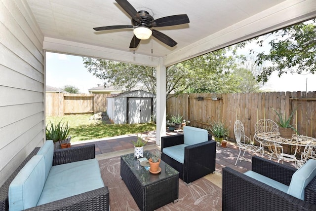 view of patio / terrace with an outdoor living space and a storage unit