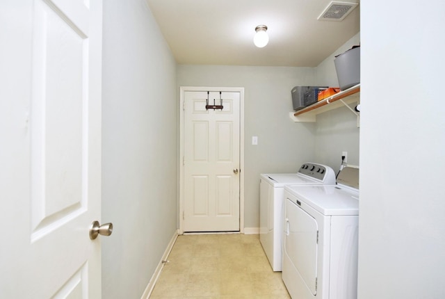 washroom with separate washer and dryer