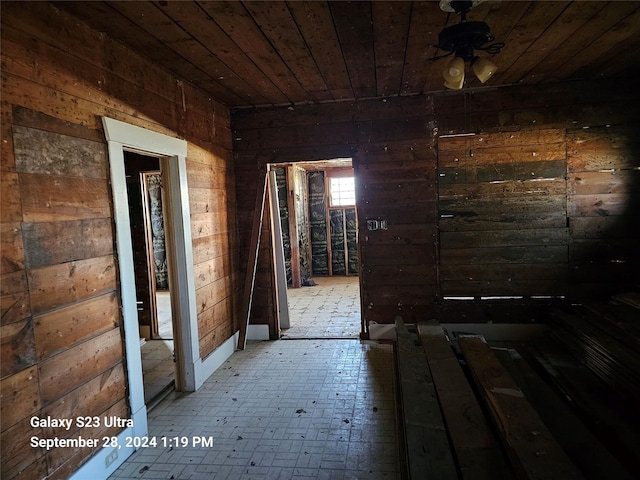 miscellaneous room with wooden walls and wood ceiling