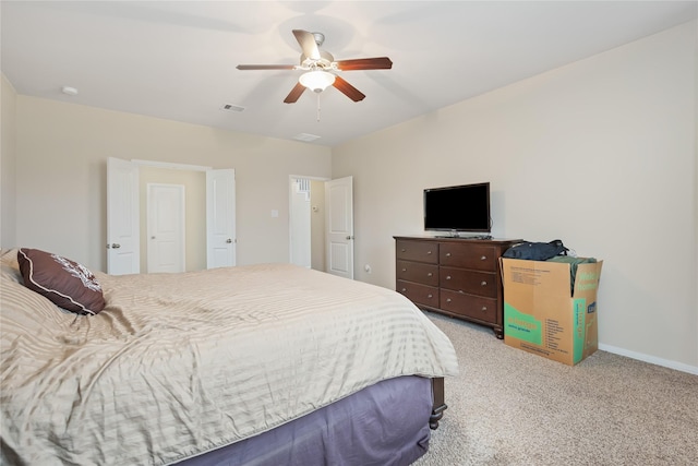 bedroom with ceiling fan and light colored carpet