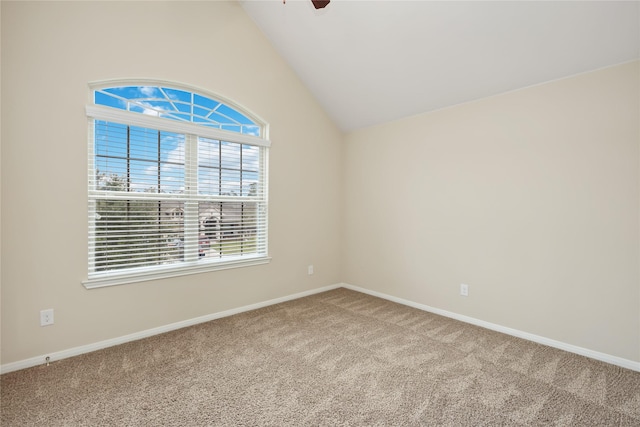 spare room featuring carpet floors, ceiling fan, and lofted ceiling