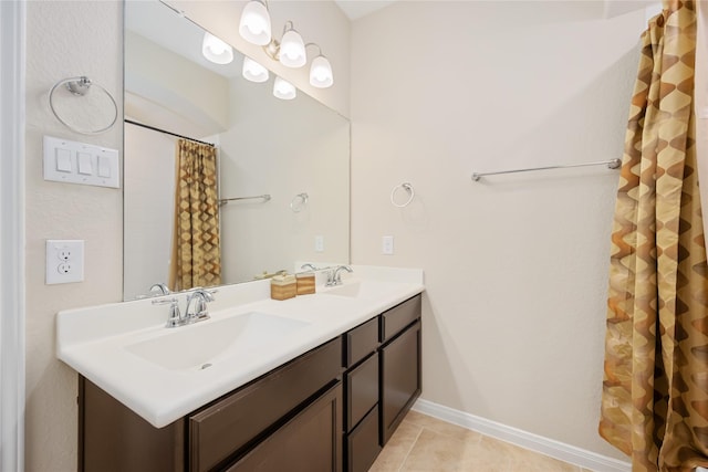 bathroom featuring tile patterned flooring and vanity