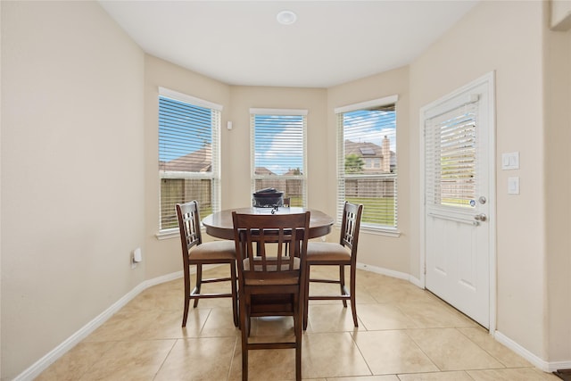 dining area with light tile patterned floors