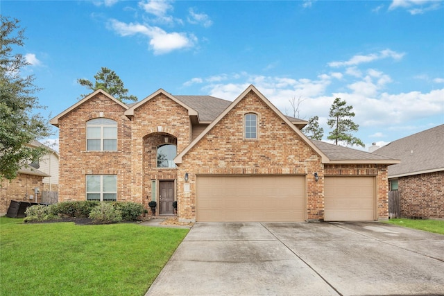 front facade featuring a garage, a front yard, and central AC