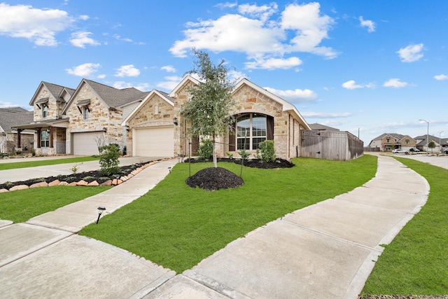 view of front of home featuring a garage and a front lawn