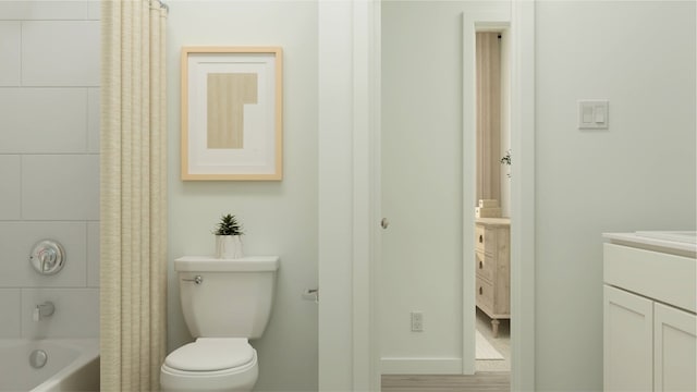 full bathroom featuring toilet, vanity, and shower / bath combination with curtain