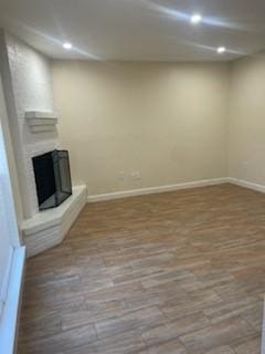 unfurnished living room with hardwood / wood-style flooring