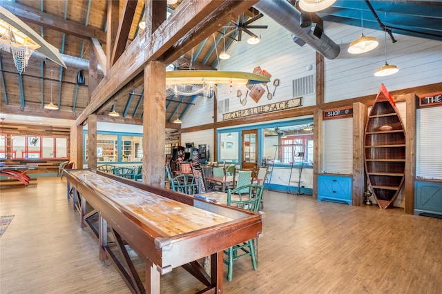 26210 Bluejack National Blvd Unit 14, Montgomery, TX 77316 - playroom featuring ceiling fan, wood-type flooring, high vaulted ceiling, beamed ceiling, and wood walls