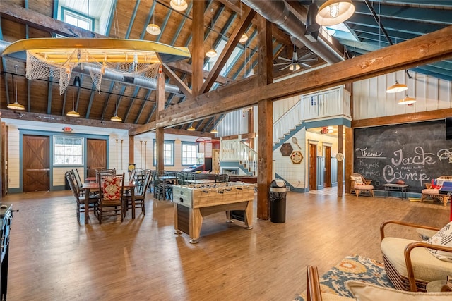 26210 Bluejack National Blvd Unit 14, Montgomery, TX 77316 - recreation room featuring beam ceiling, high vaulted ceiling, and wood-type flooring
