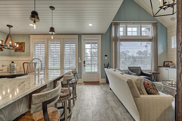 26210 Bluejack National Blvd Unit 14, Montgomery, TX 77316 - living room featuring hardwood / wood-style flooring, a notable chandelier, wooden ceiling, and lofted ceiling