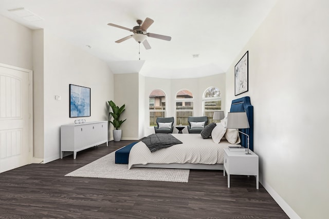 bedroom featuring ceiling fan and dark hardwood / wood-style flooring