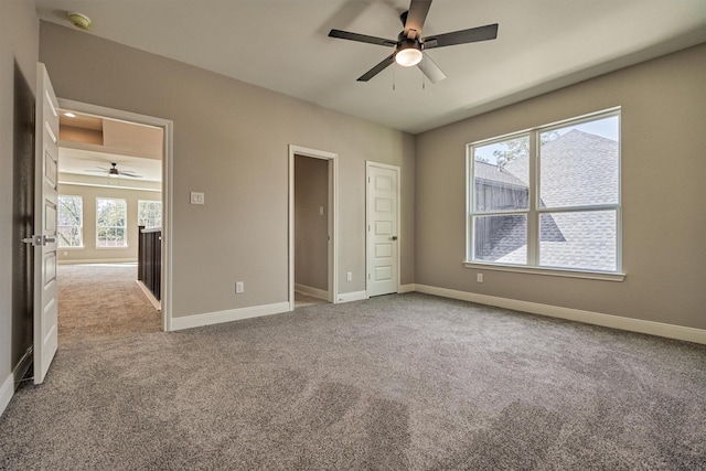 unfurnished bedroom featuring ceiling fan and light carpet