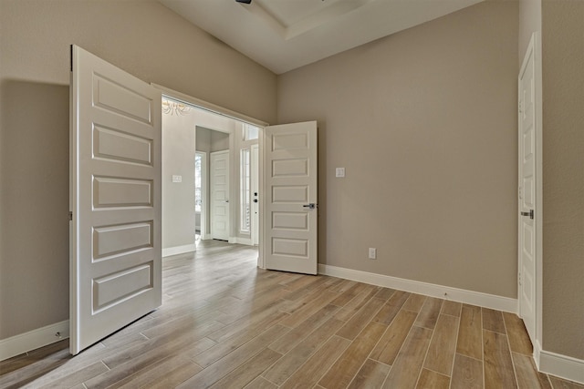 spare room with light hardwood / wood-style flooring