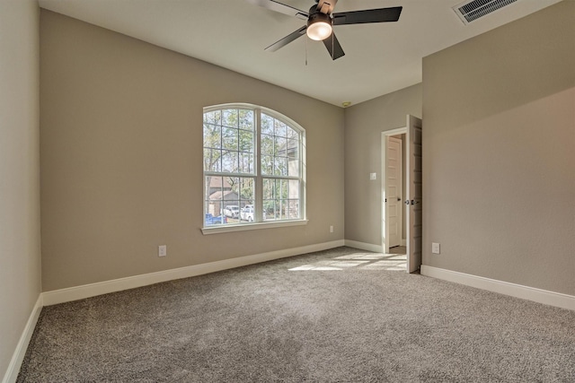 spare room with carpet floors and ceiling fan