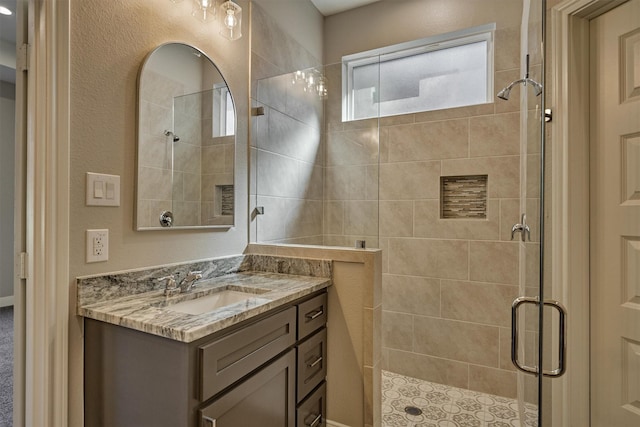 bathroom with vanity and walk in shower