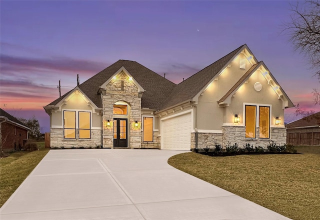 view of front facade featuring a yard and a garage