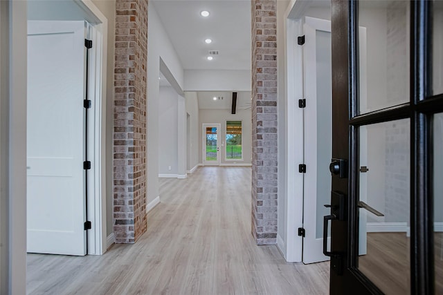 hallway featuring light wood-type flooring