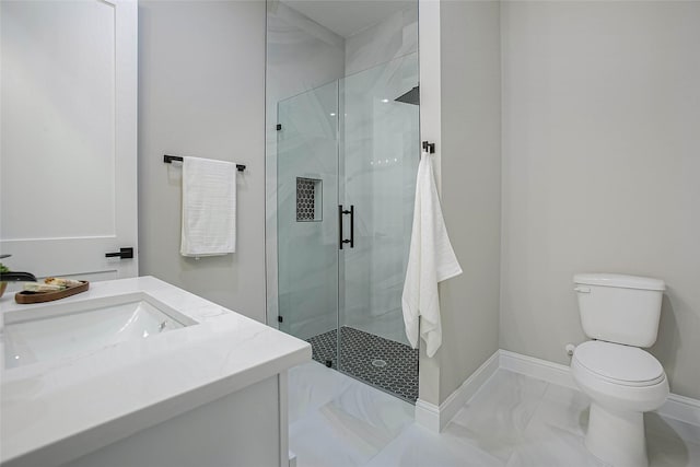 bathroom with vanity, toilet, and walk in shower