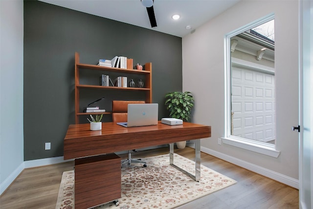 office space with light hardwood / wood-style floors and a wealth of natural light