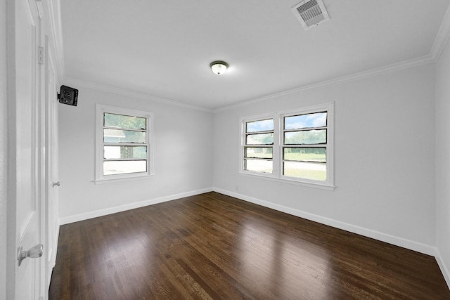 empty room with dark wood-type flooring and ornamental molding