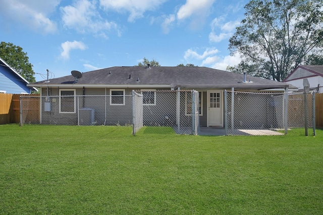 rear view of house with a lawn