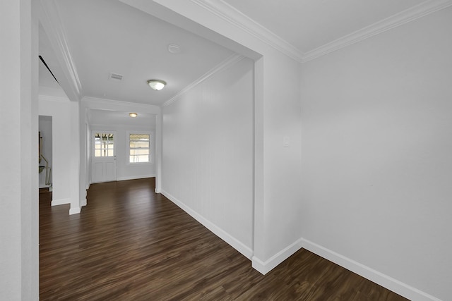 hallway featuring crown molding and dark hardwood / wood-style flooring