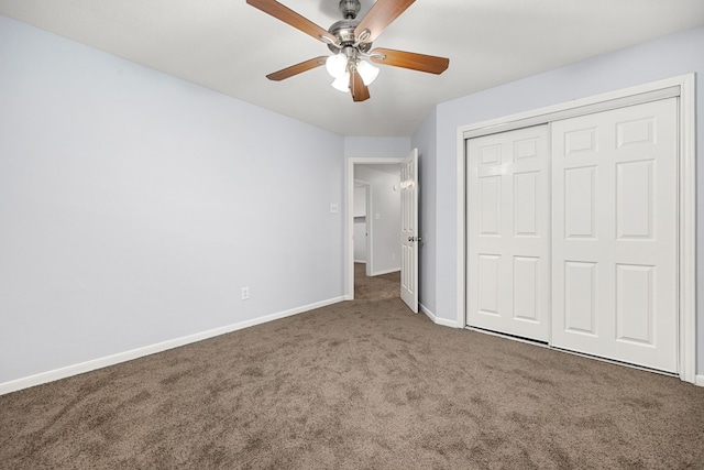 unfurnished bedroom with carpet flooring, ceiling fan, and a closet