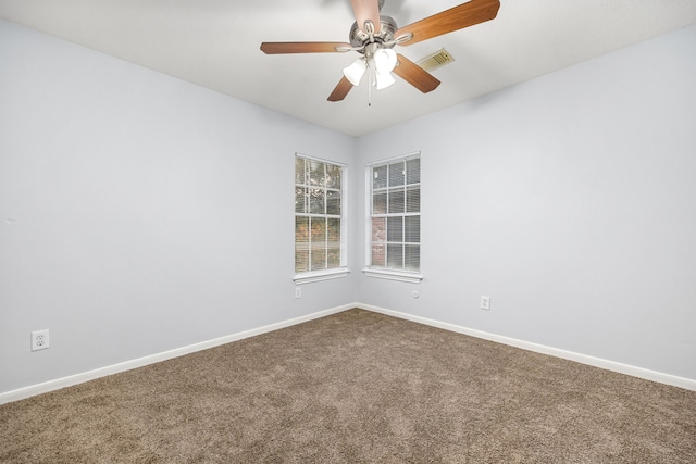 spare room with carpet and ceiling fan