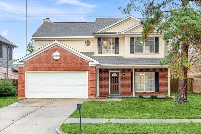 front of property with a garage and a front lawn