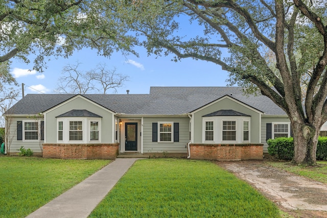 ranch-style house with a front lawn