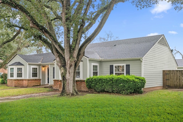 ranch-style house featuring a front lawn