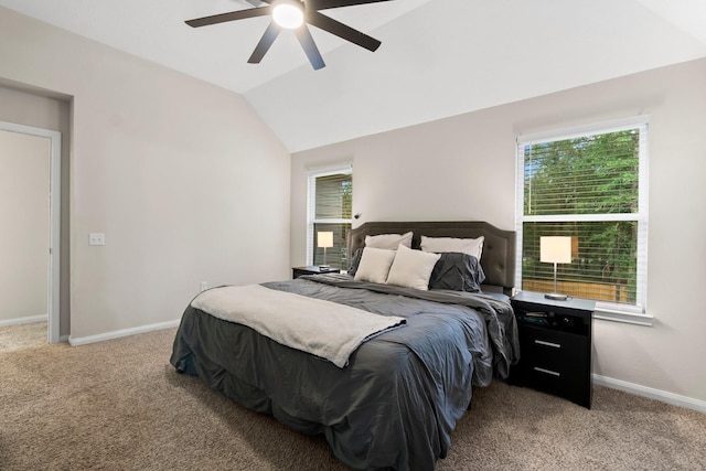 carpeted bedroom featuring ceiling fan and lofted ceiling