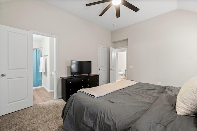 carpeted bedroom featuring ceiling fan, connected bathroom, and vaulted ceiling