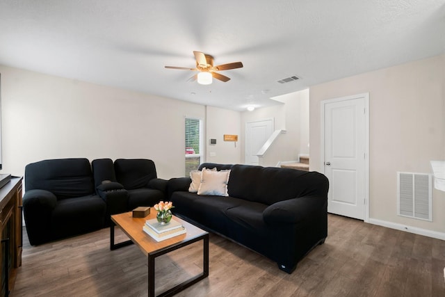 living room with ceiling fan and wood-type flooring