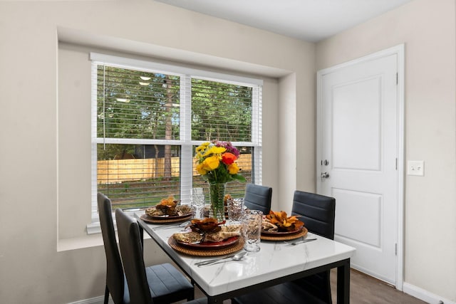 dining area with hardwood / wood-style flooring