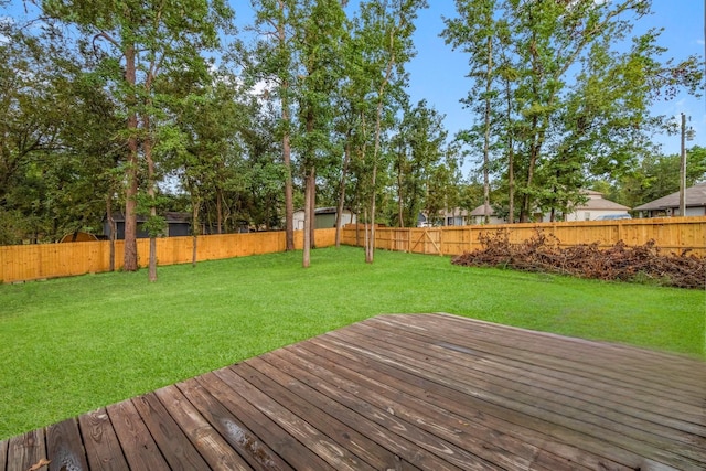 wooden terrace with a yard