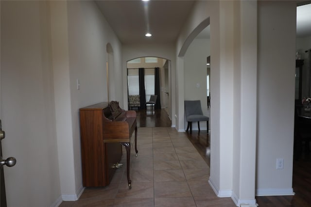 hall with light tile patterned flooring