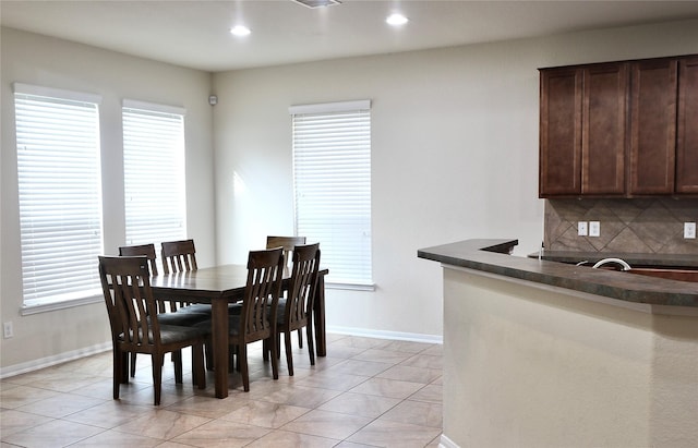 dining space with light tile patterned floors