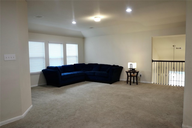 living room with carpet and lofted ceiling