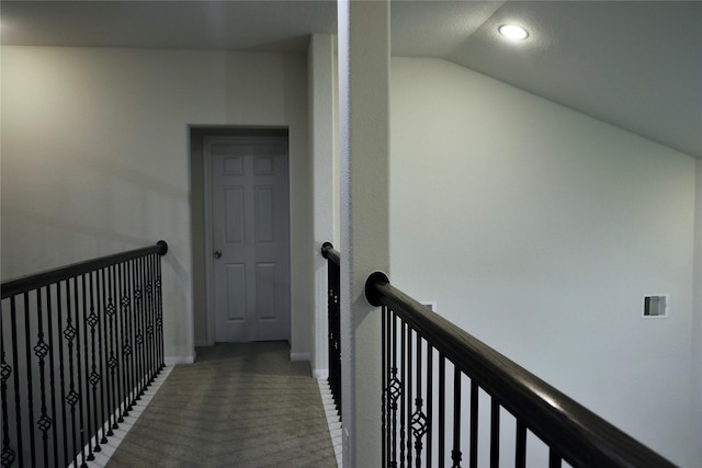 hall featuring vaulted ceiling