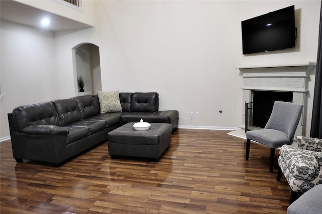 living room with dark hardwood / wood-style floors