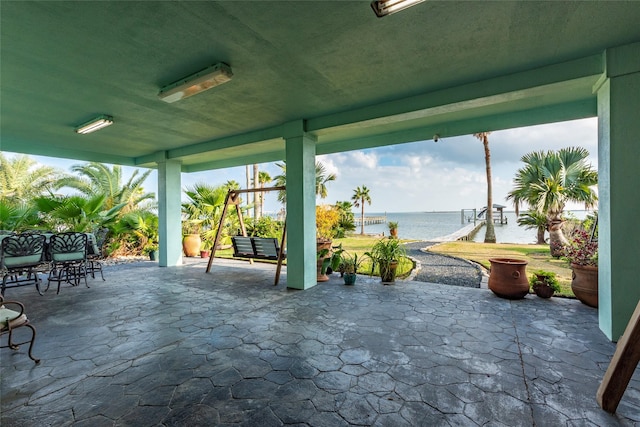 view of patio / terrace with a water view