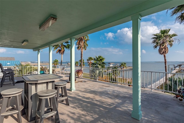 view of patio / terrace with a water view