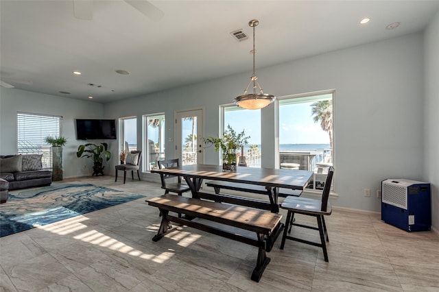 dining space with ceiling fan