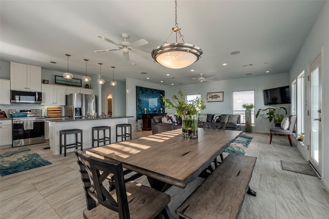 dining area with ceiling fan